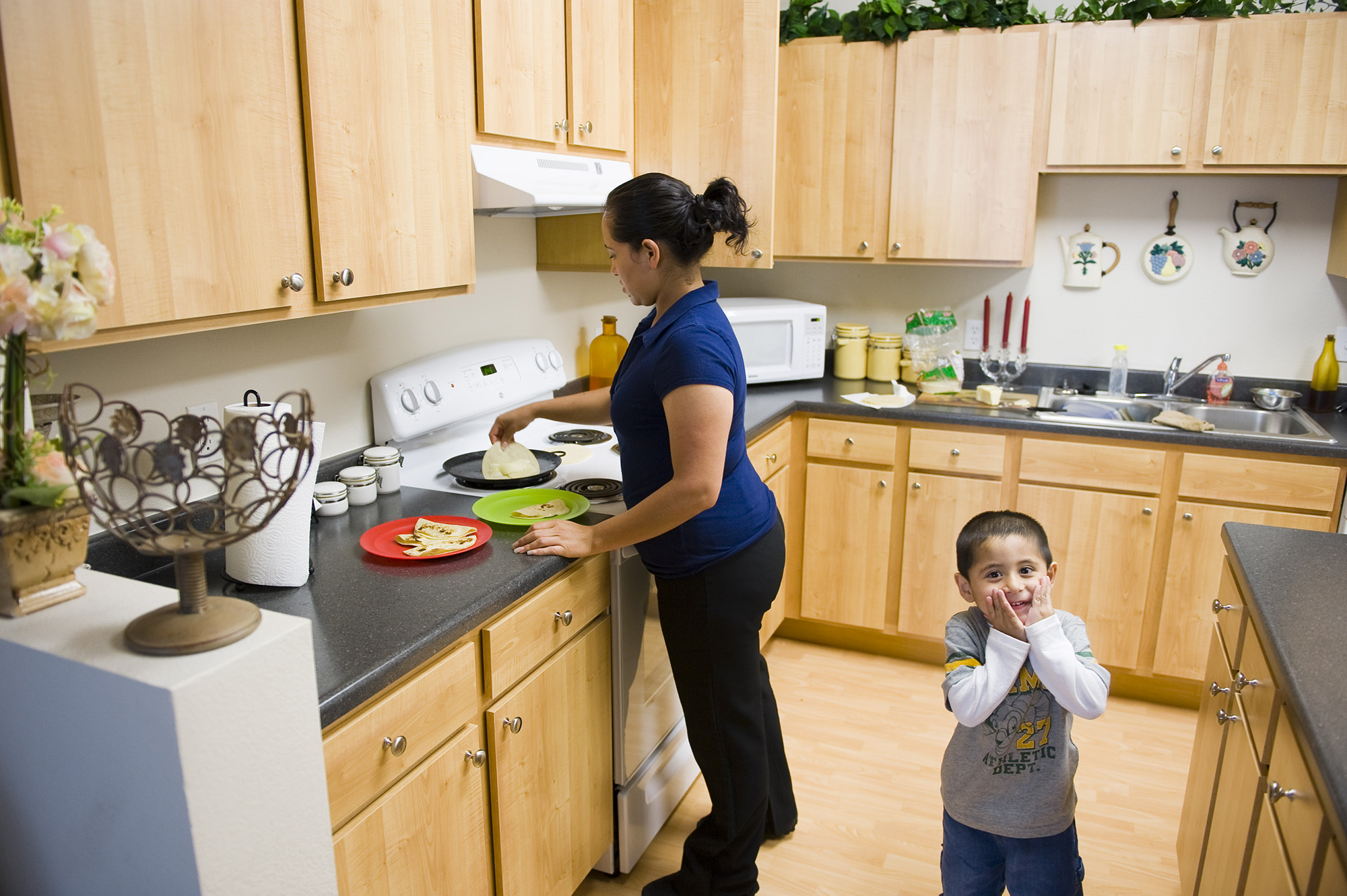 Interior view of kitchen with residents in paloma villas 3