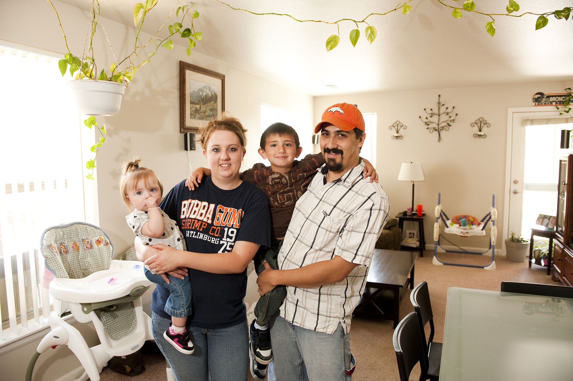 photo of family residents in living room at villas on the bluff - delta colorado