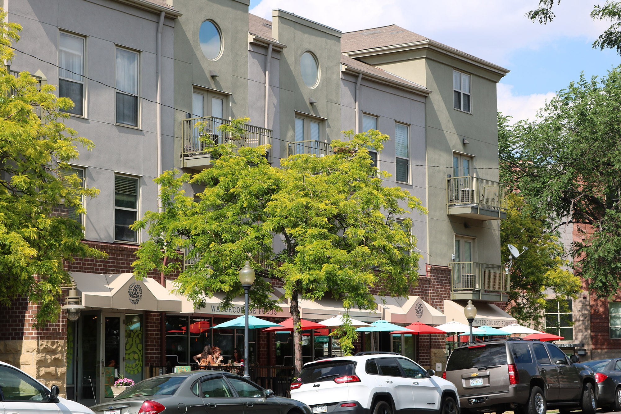 exterior street facing facade of briargate apartmetns showing street level retail