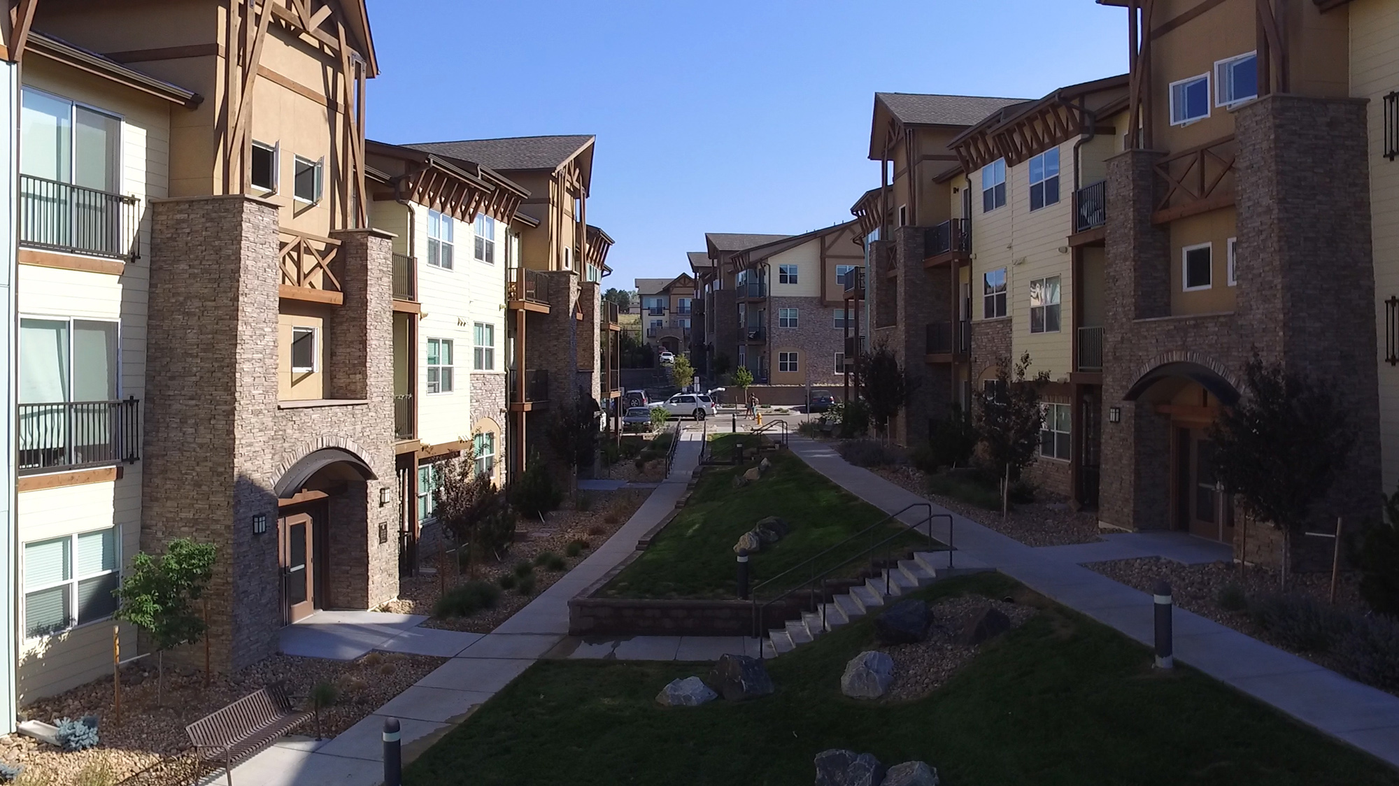 Garden are inbetween two 3 storey buildings at Montane in Parker