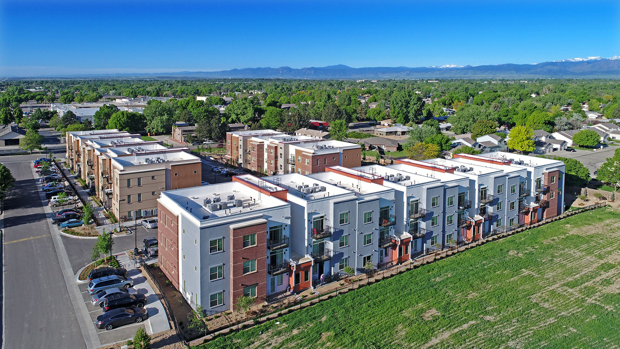 bird's eye view of crissman community with mountains in background
