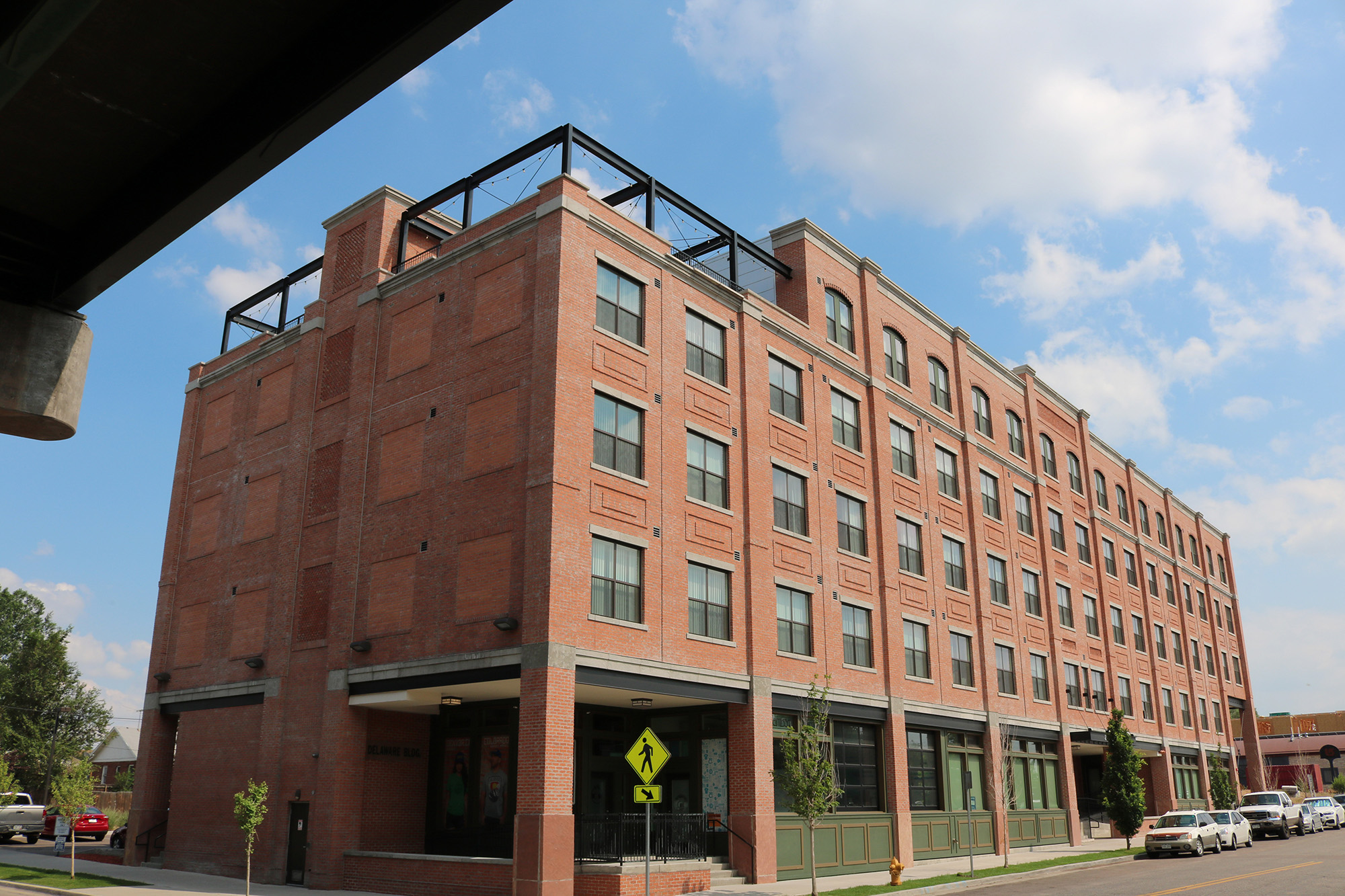 corner of 5 storey brick building evans station lofts