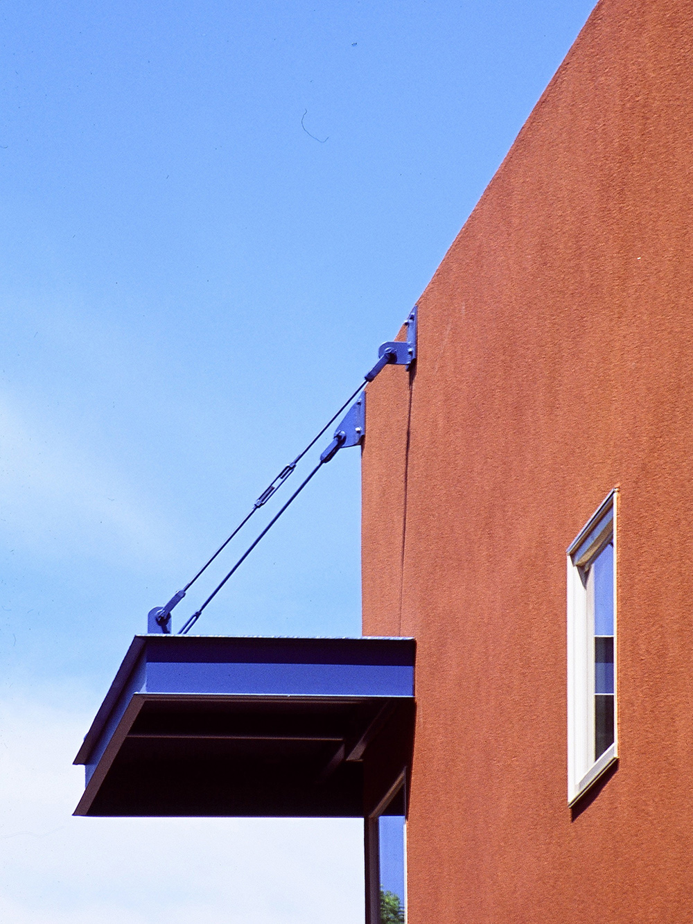 hung metal canopy painted blue at macon townhome