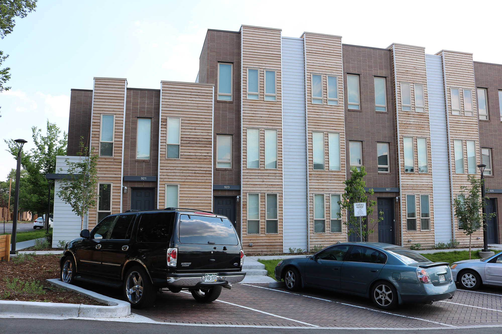 exterior facade view of mariposa townhomes with permeable pavers in parking areas in foreground