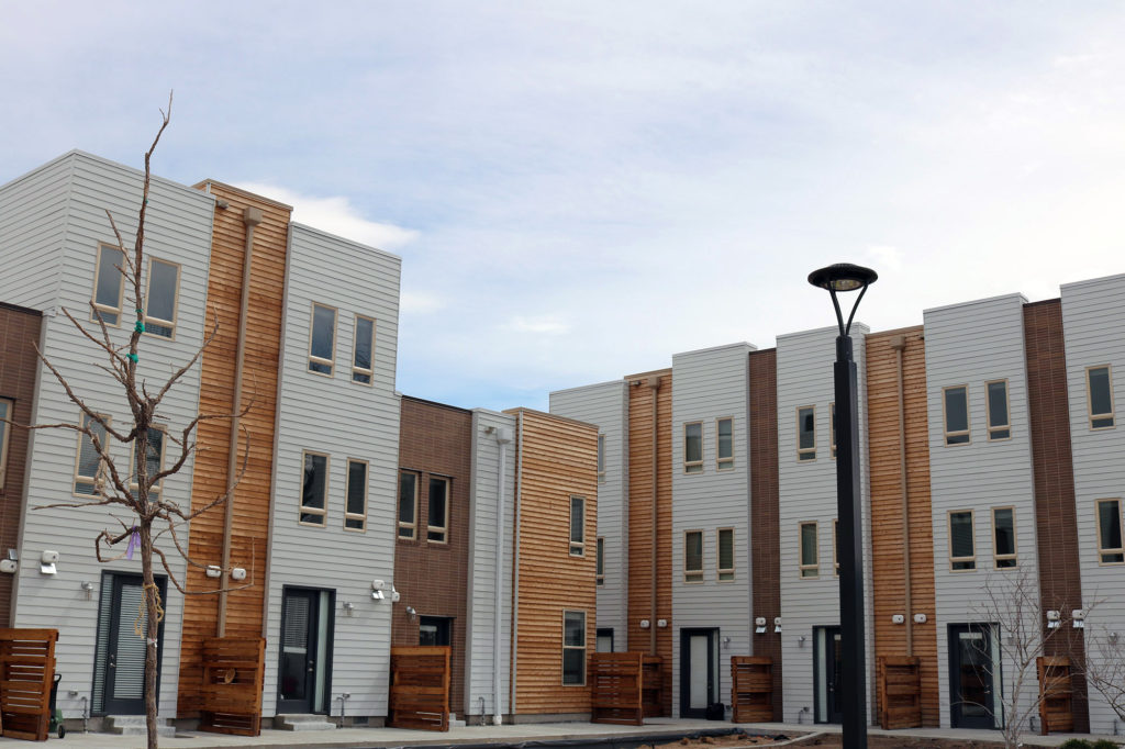 view of fenced back porches facing courtyard at mariposa townhomes