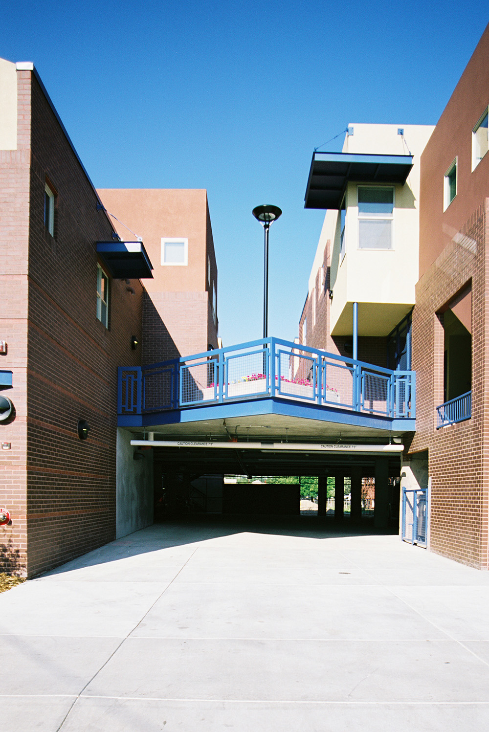 View of garage entry and courtyard on podium at macon and moline townhomes