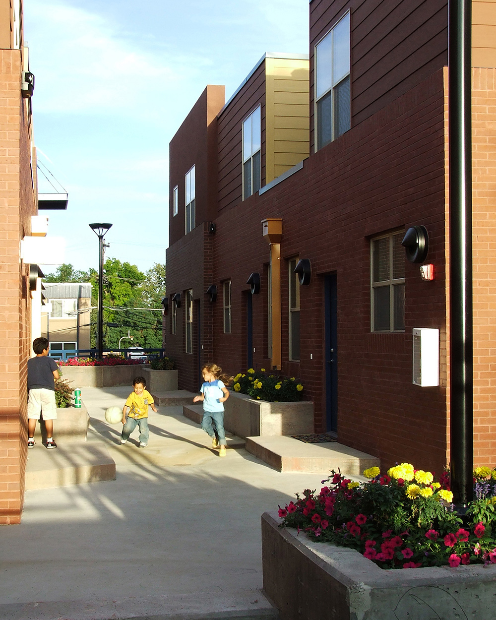 view of courtyard with kids playing in moline townhome