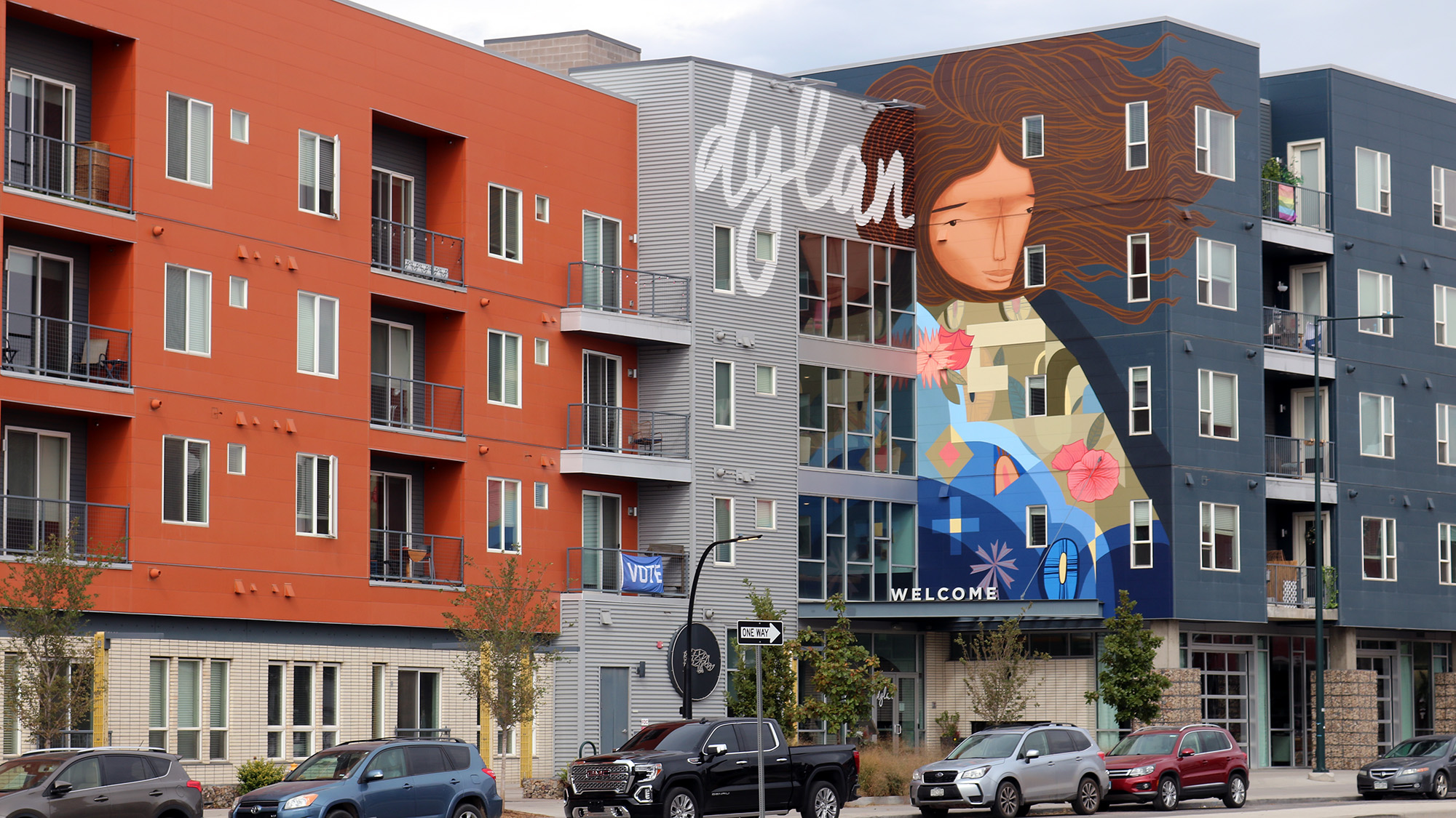 Exterior front entrance of Dylan apartmetns with art mural