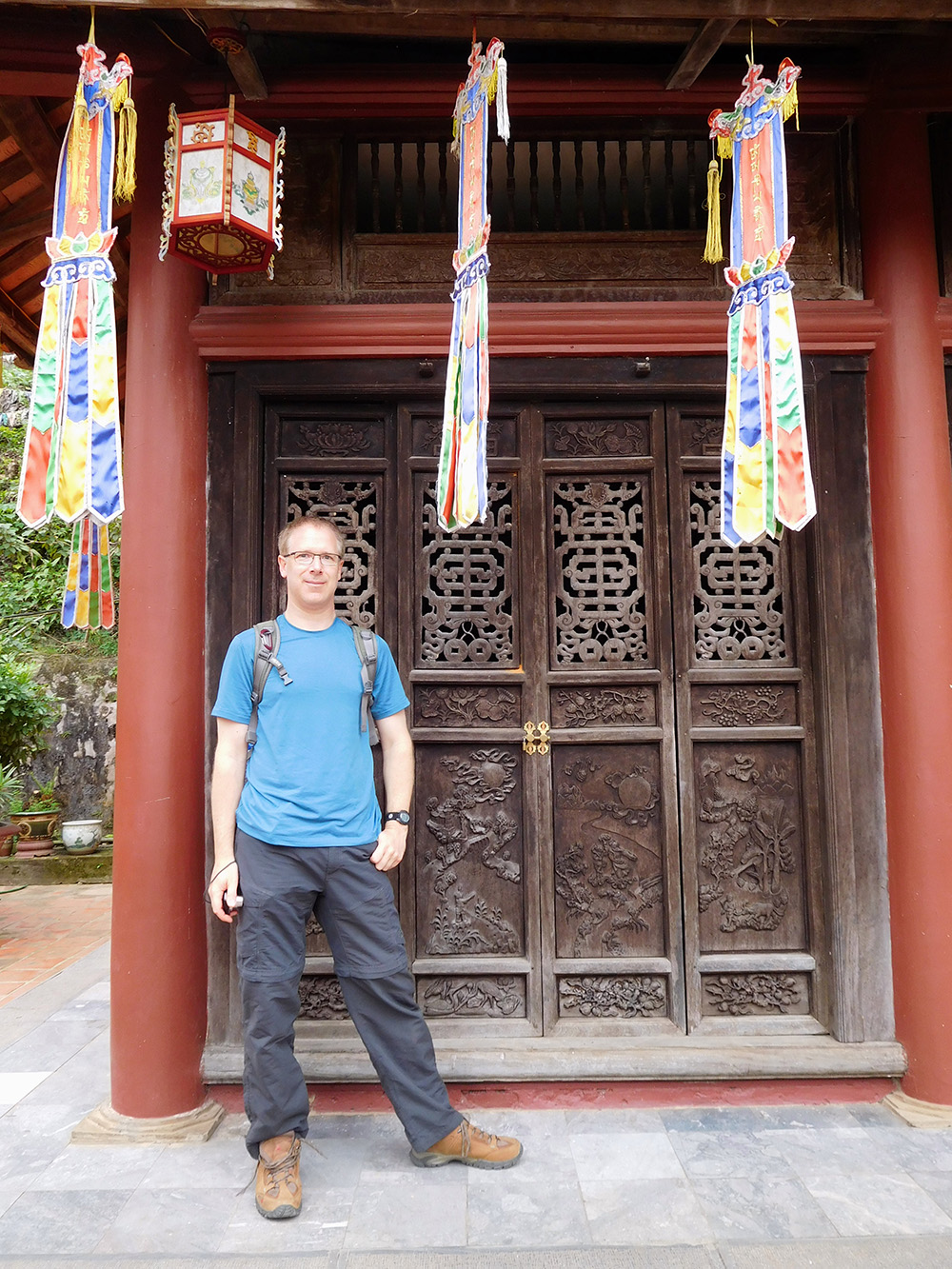 Alan in front of a temple doorway in Hanoi vietnam